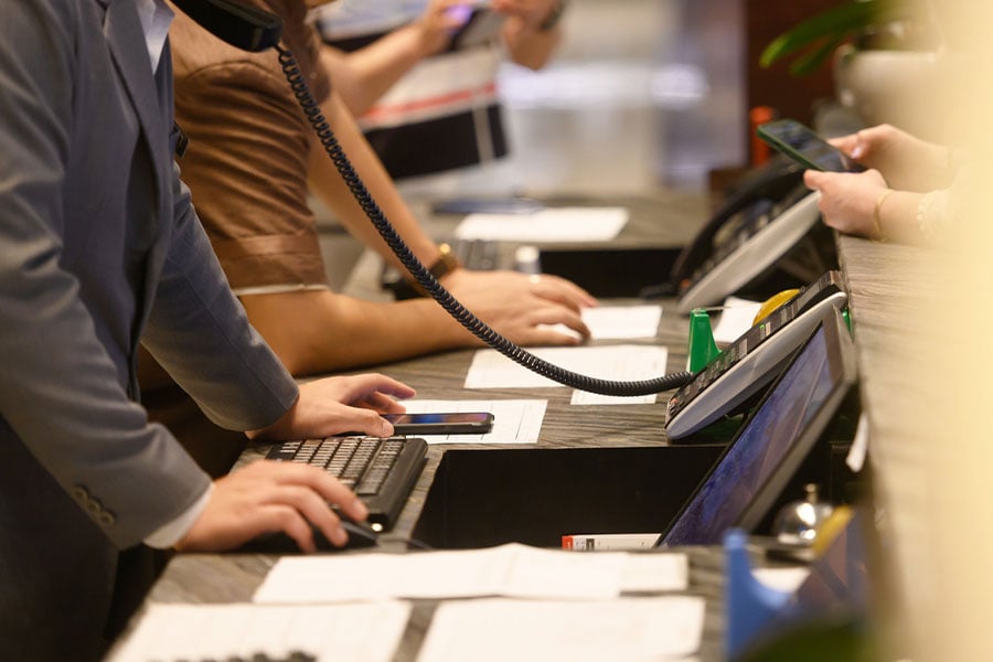Busy receptionists at a hotel